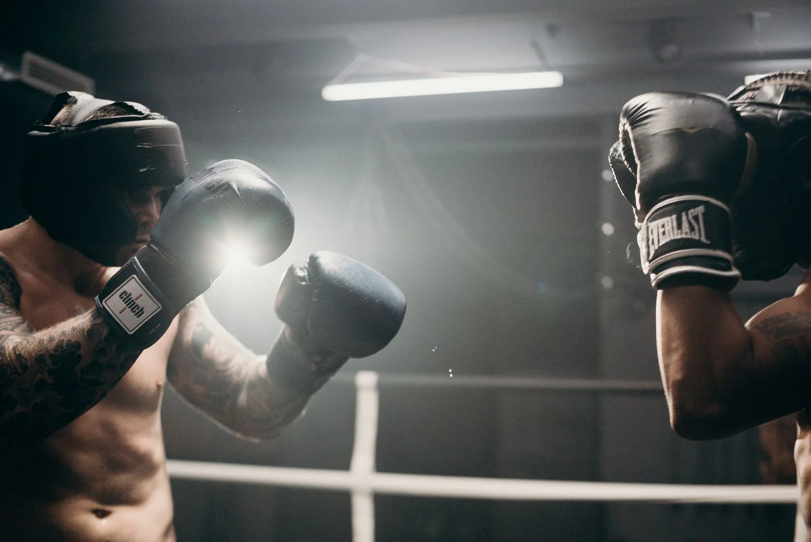 Boxing gloves raised during a training session